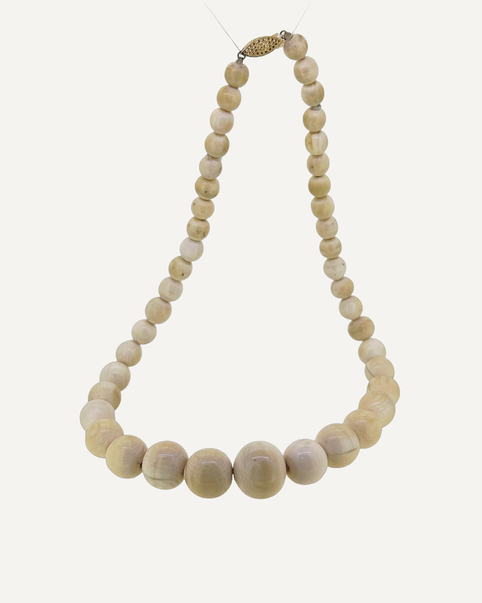 Antique ivory beaded necklace, Strung with graduated ivory beads. Antique style necklace.