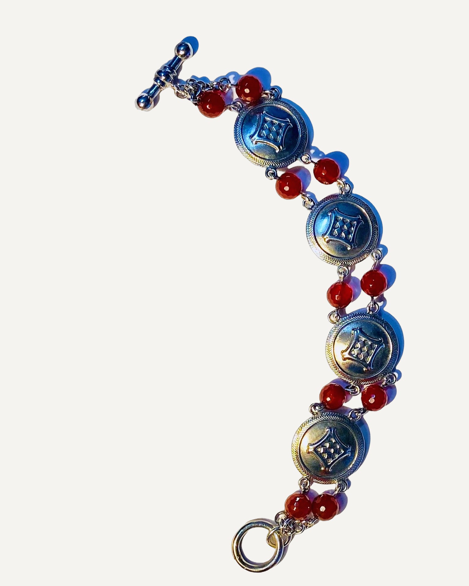 Silver disc and carnelian bead T-bar bracelet, Silver bracelet with disc links and carnelian beads.