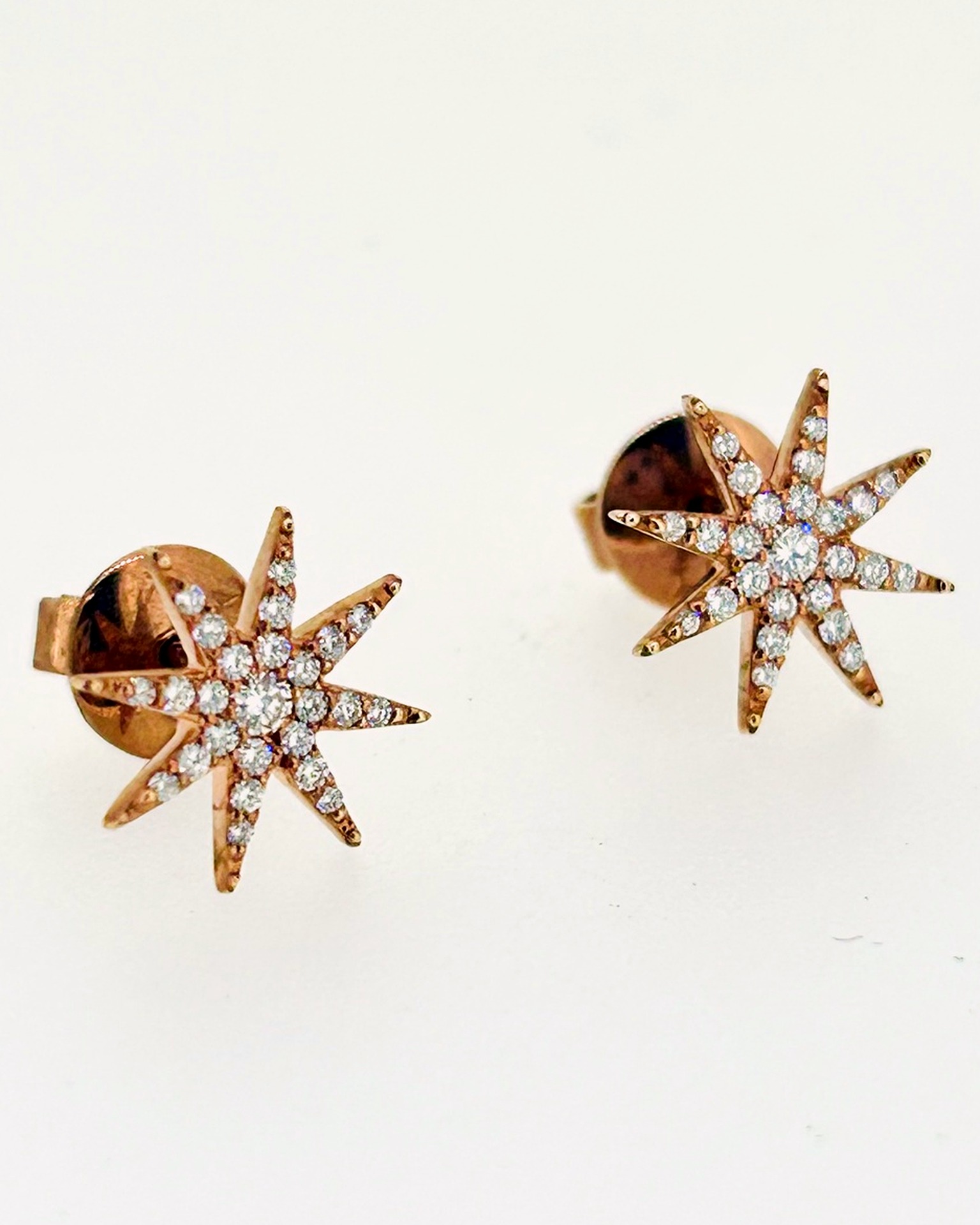 18-carat Rose Gold Diamond Star Stud Earrings, Starburst stud earrings in rose gold. Diam stars with butterfly backs.
