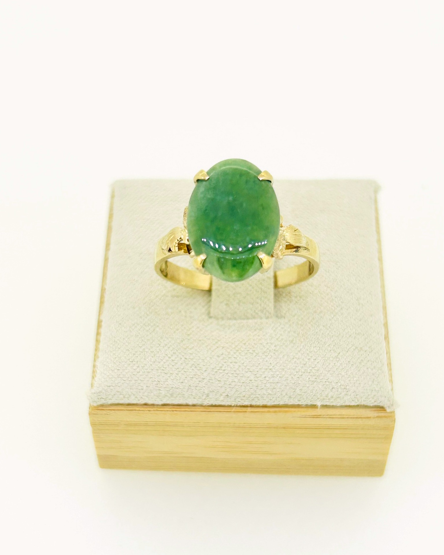 14-carat Yellow Gold Jade Dress Ring, An oval jade dress ring in yellow gold.