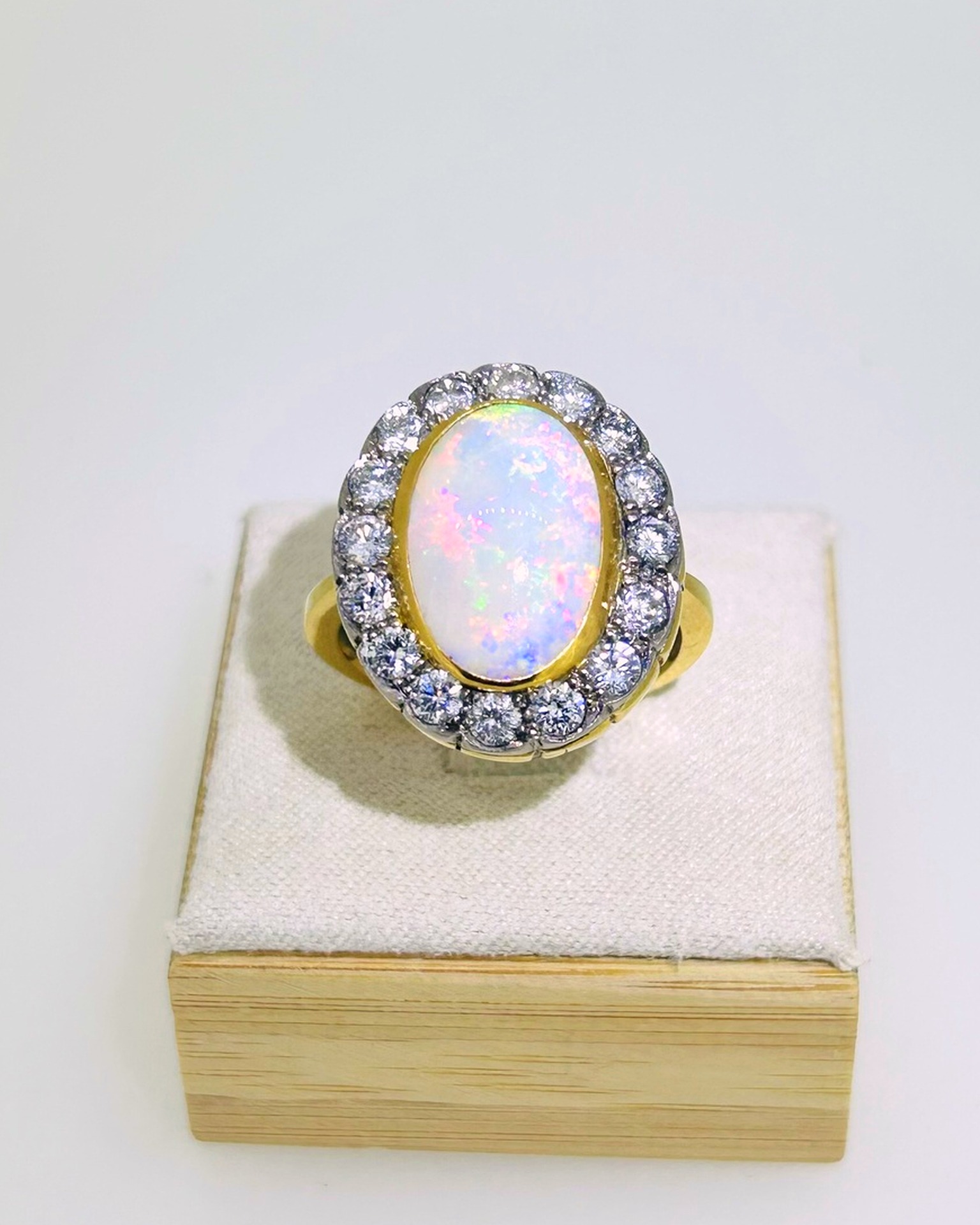 Yellow Gold Opal and Diamond Ring, A beautiful 3.45 carat opal set with diamonds of 1.29 total diamond weight
