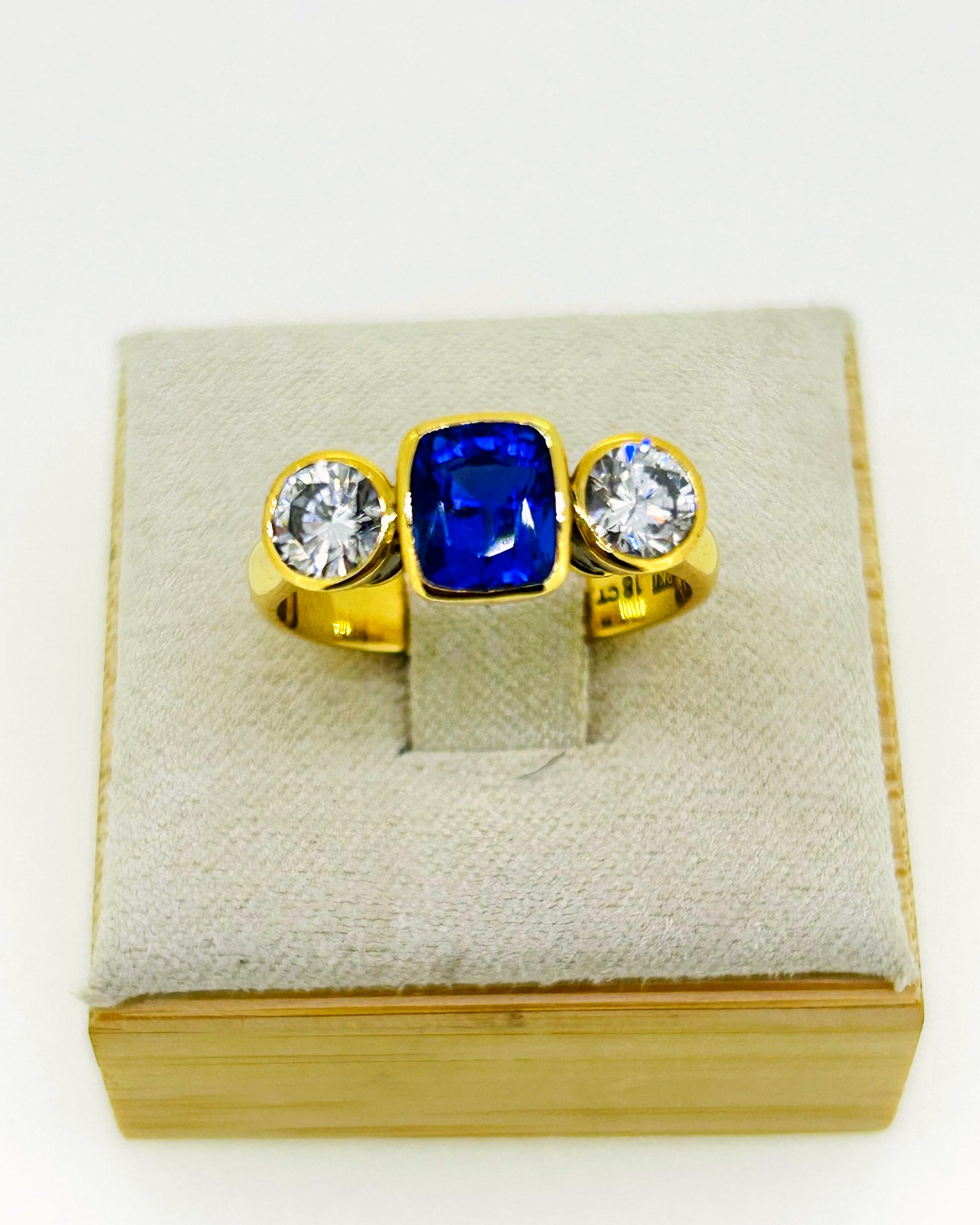 Tanzanite & diamond ring, 18ct YG 1.9ct Tanzanite with 2 .45ct brilliant cut diamonds in basket settings