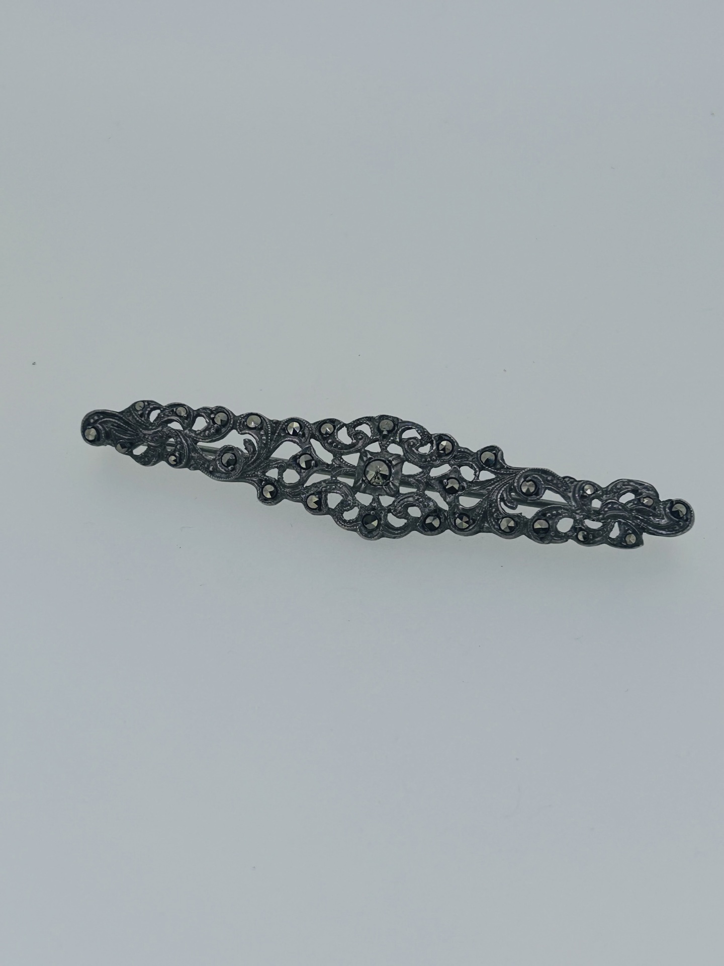Vintage silver marcasite bar brooch, An ornate openwork silver brooch set with marcasites.