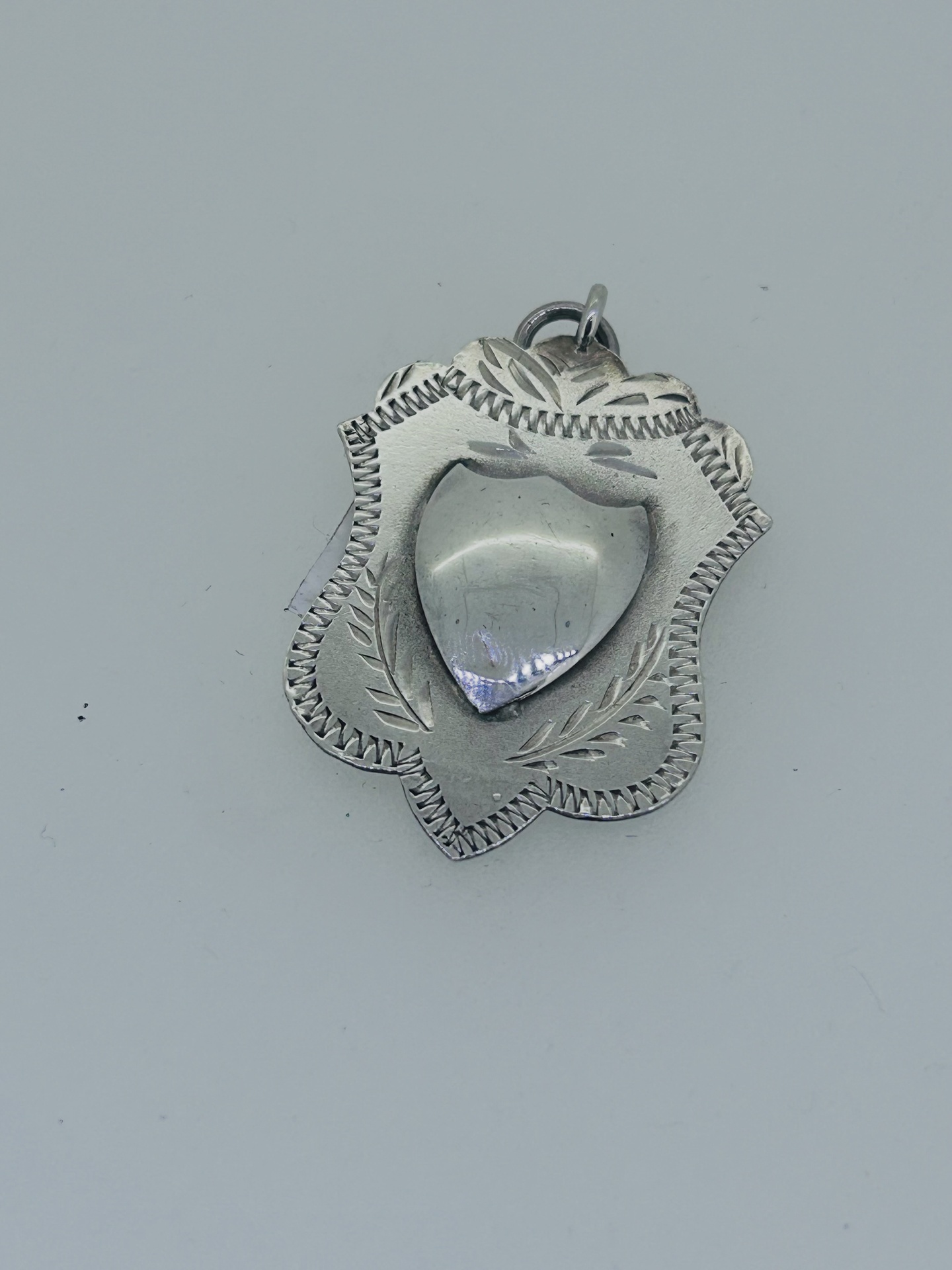 Silver vintage medal pendant, Silver vintage medal pendant with decorative engraved border.