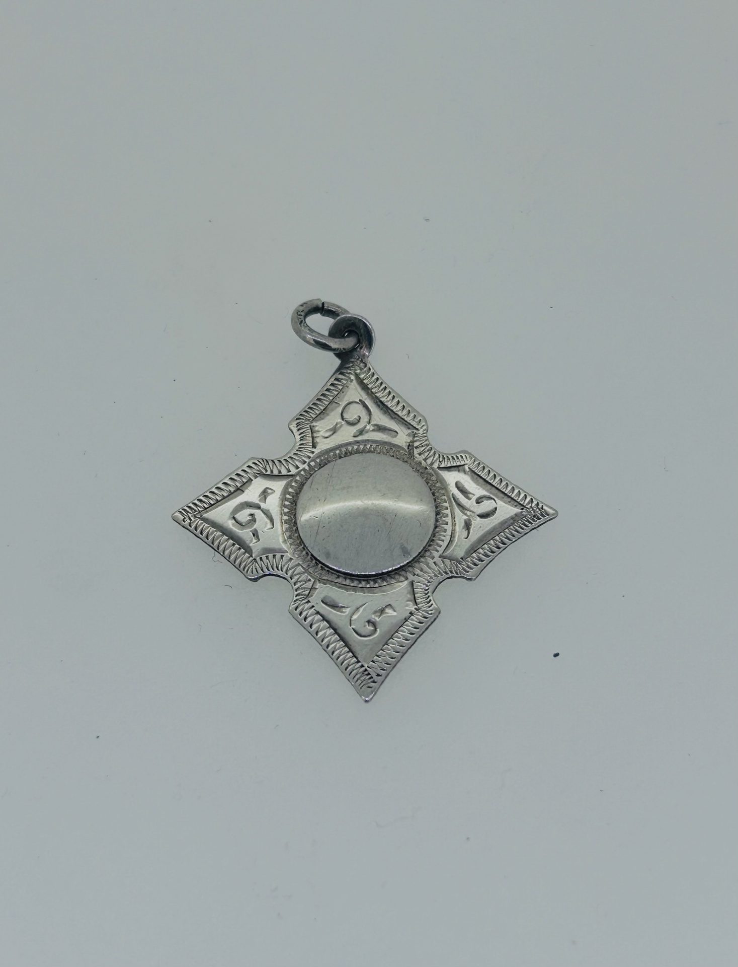 Silver vintage medal pendant, Silver vintage medal pendant with ornate engraved details.