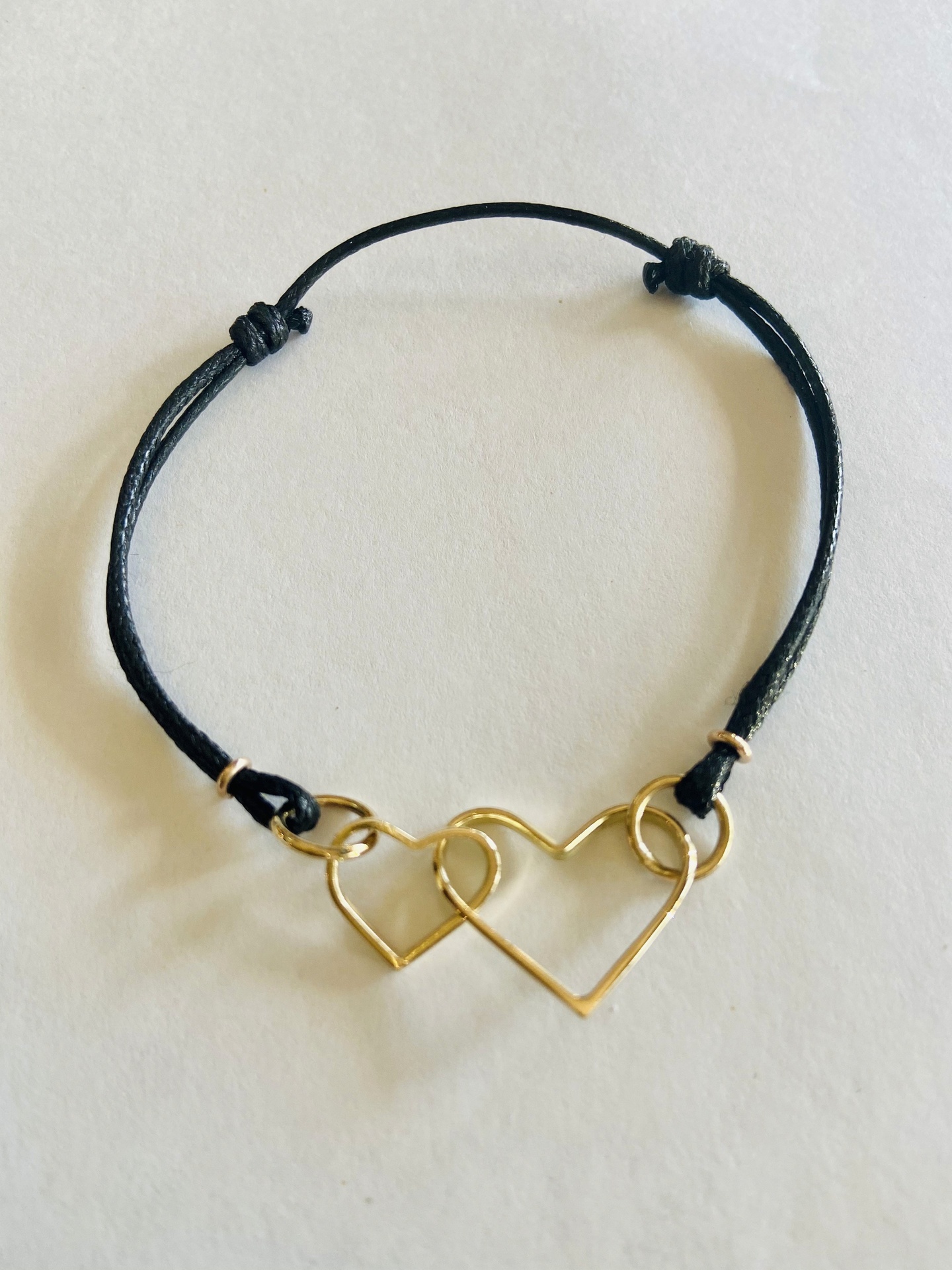 Intertwined Hearts — A Love Story in Gold and Leather, Intertwined 9ct Gold Hearts on Leather