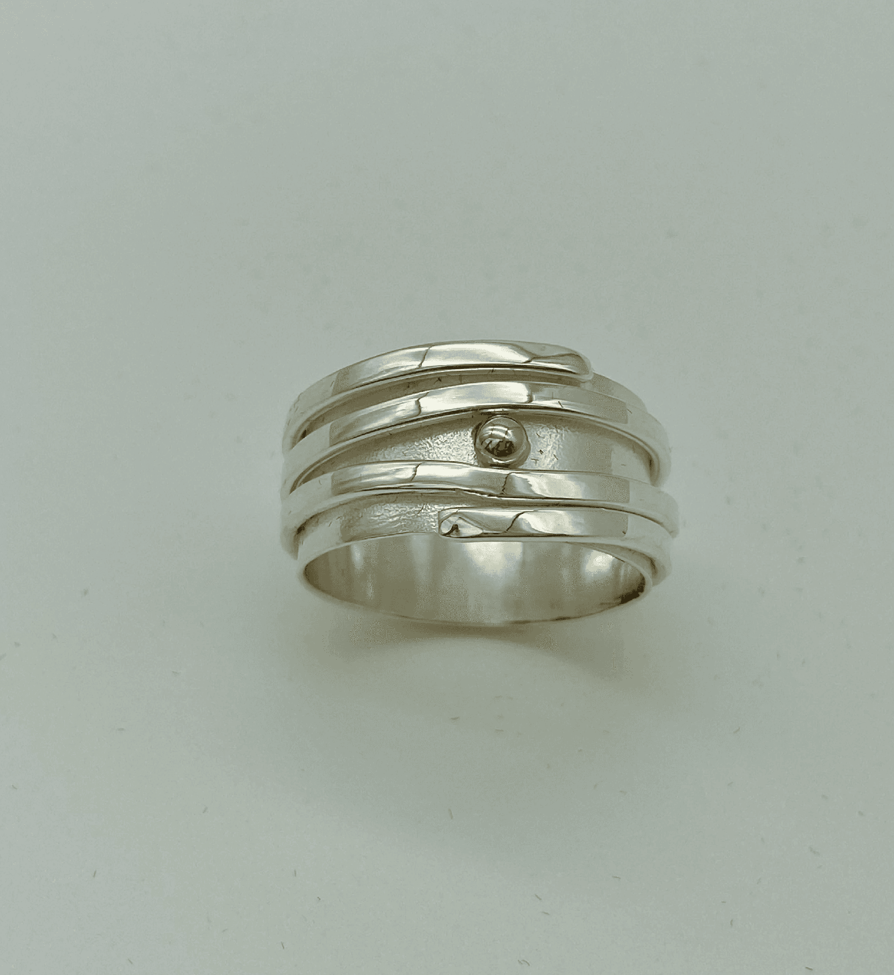 Silver Ribbon Ring with Yellow Gold Accent, A Sculptural Silver Ring with a Gold Accent