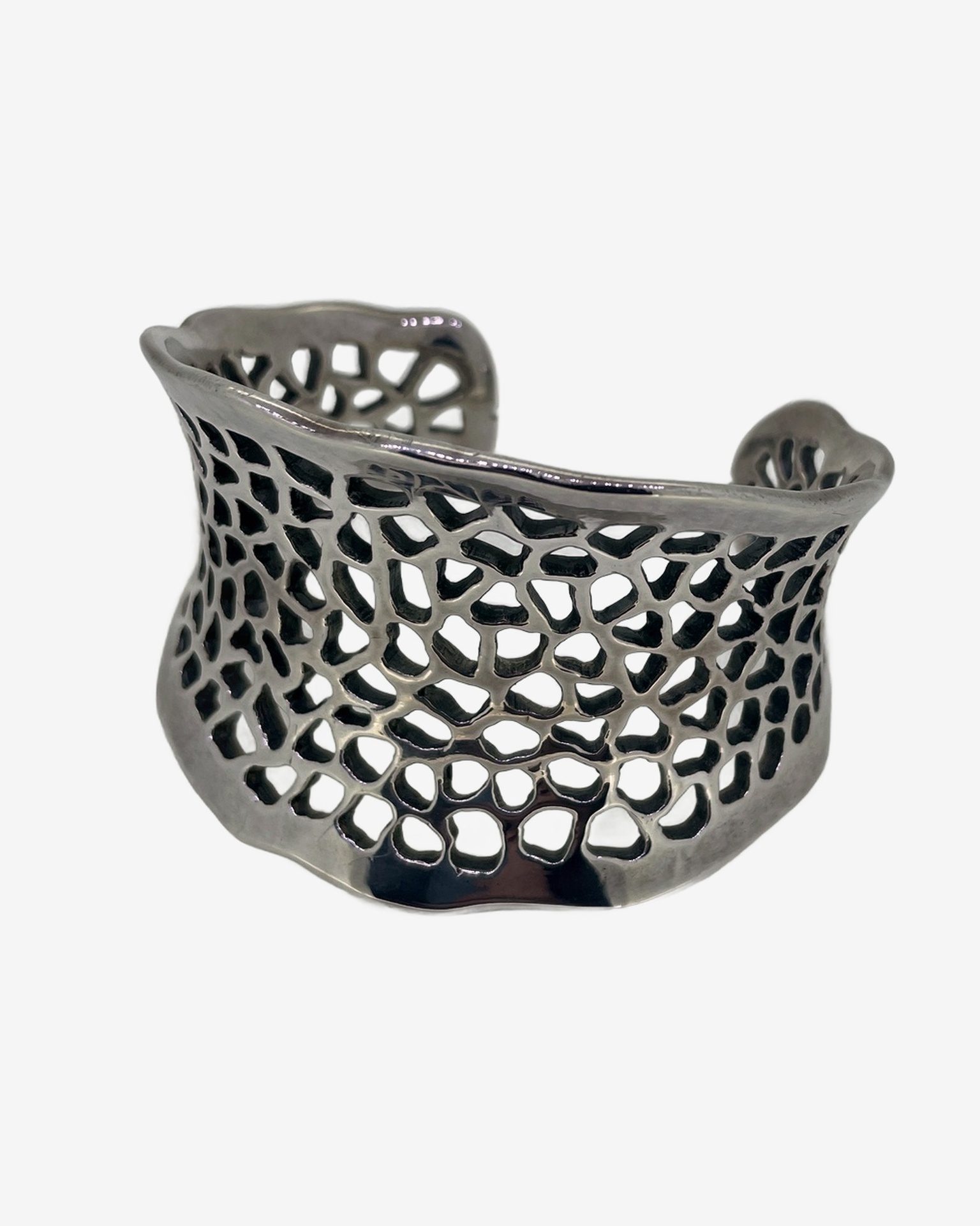 Silver Gruyere openwork cuff bracelet, An openwork silver cuff with a sculptural, organic profile.