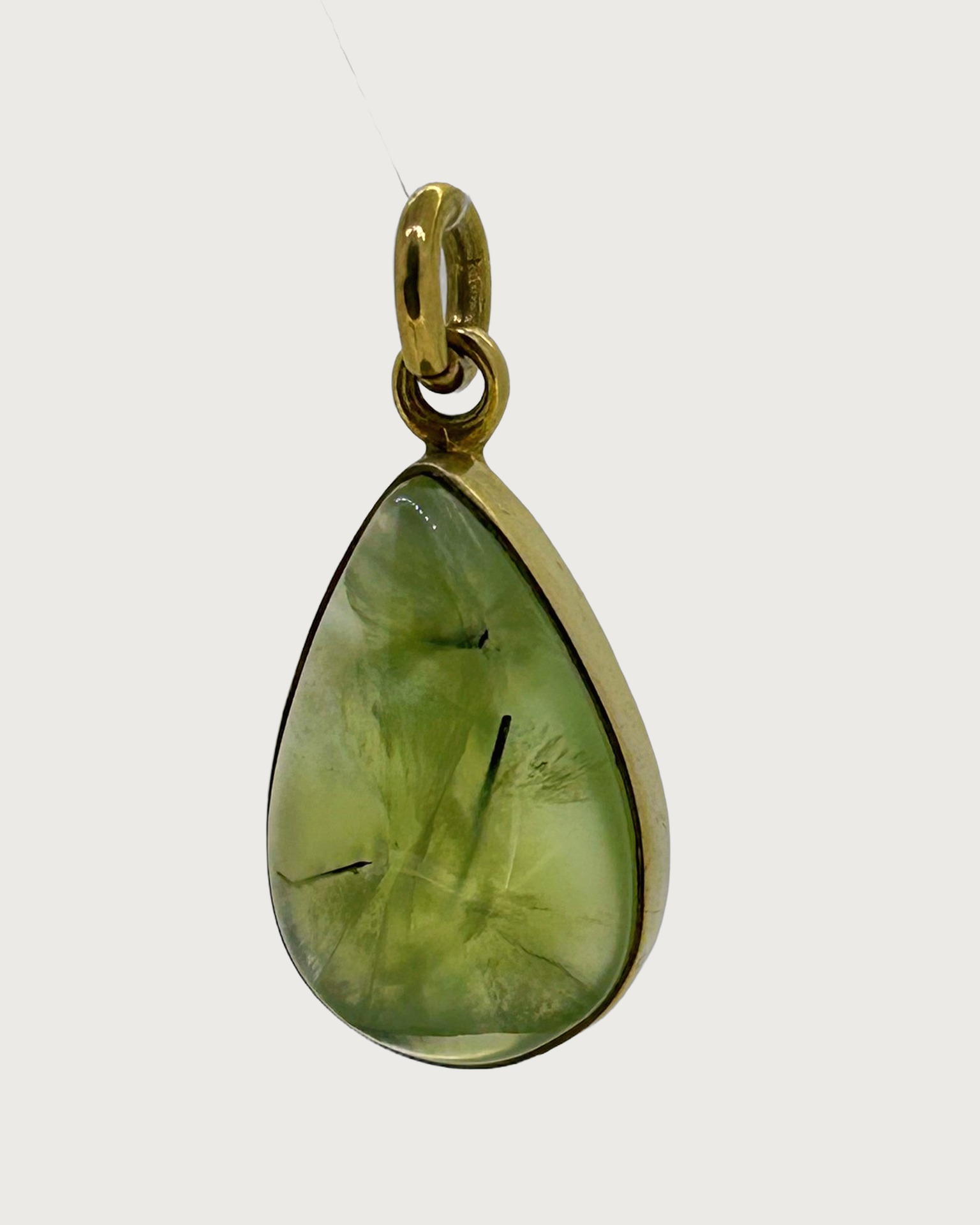 Silver Gilt and Prehnite Teardrop Pendant, Teardrop pendant with a green prehnite cabochon.