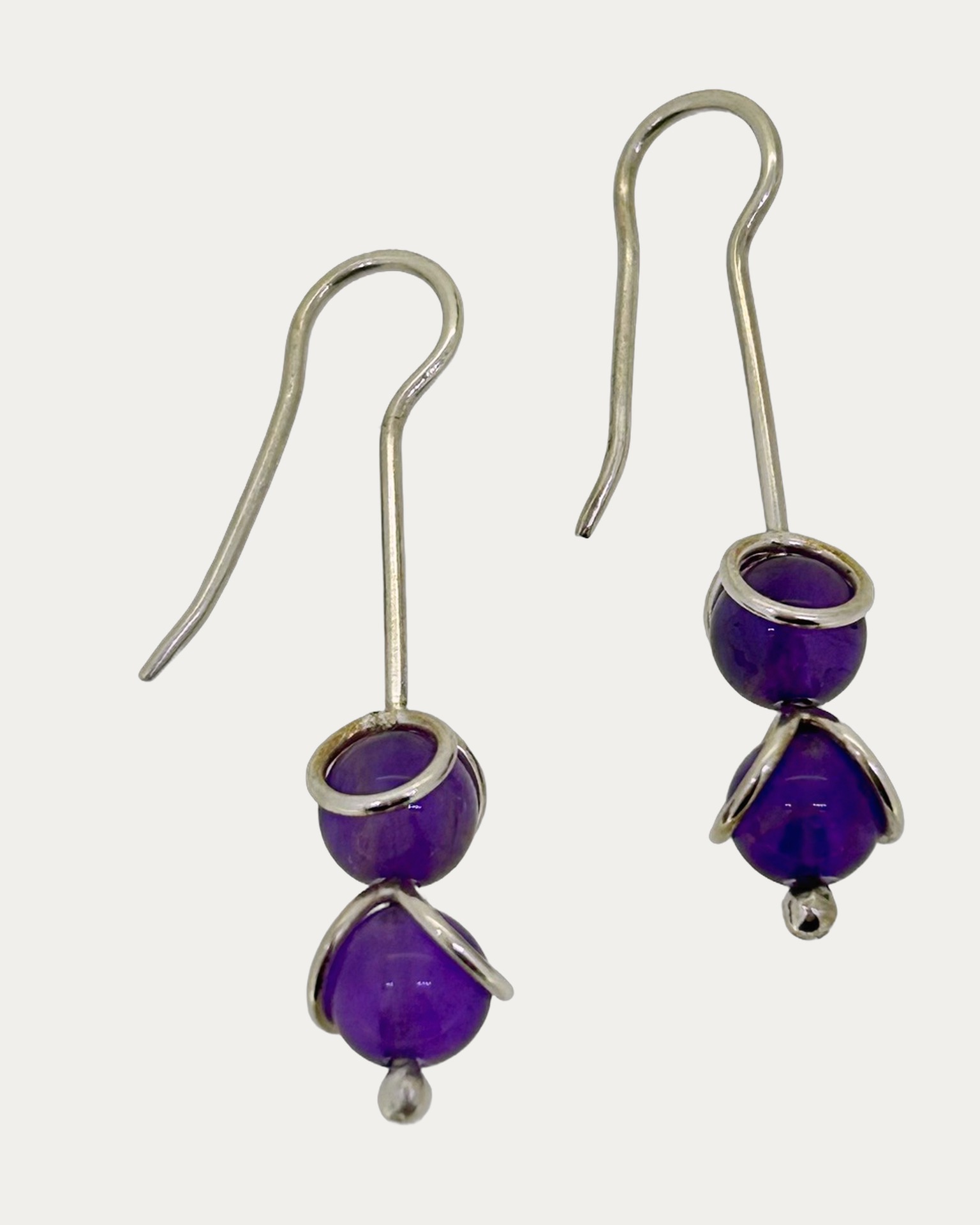 Silver double amethyst drop earrings, Two amethyst beads on each earring. Silver hooks.