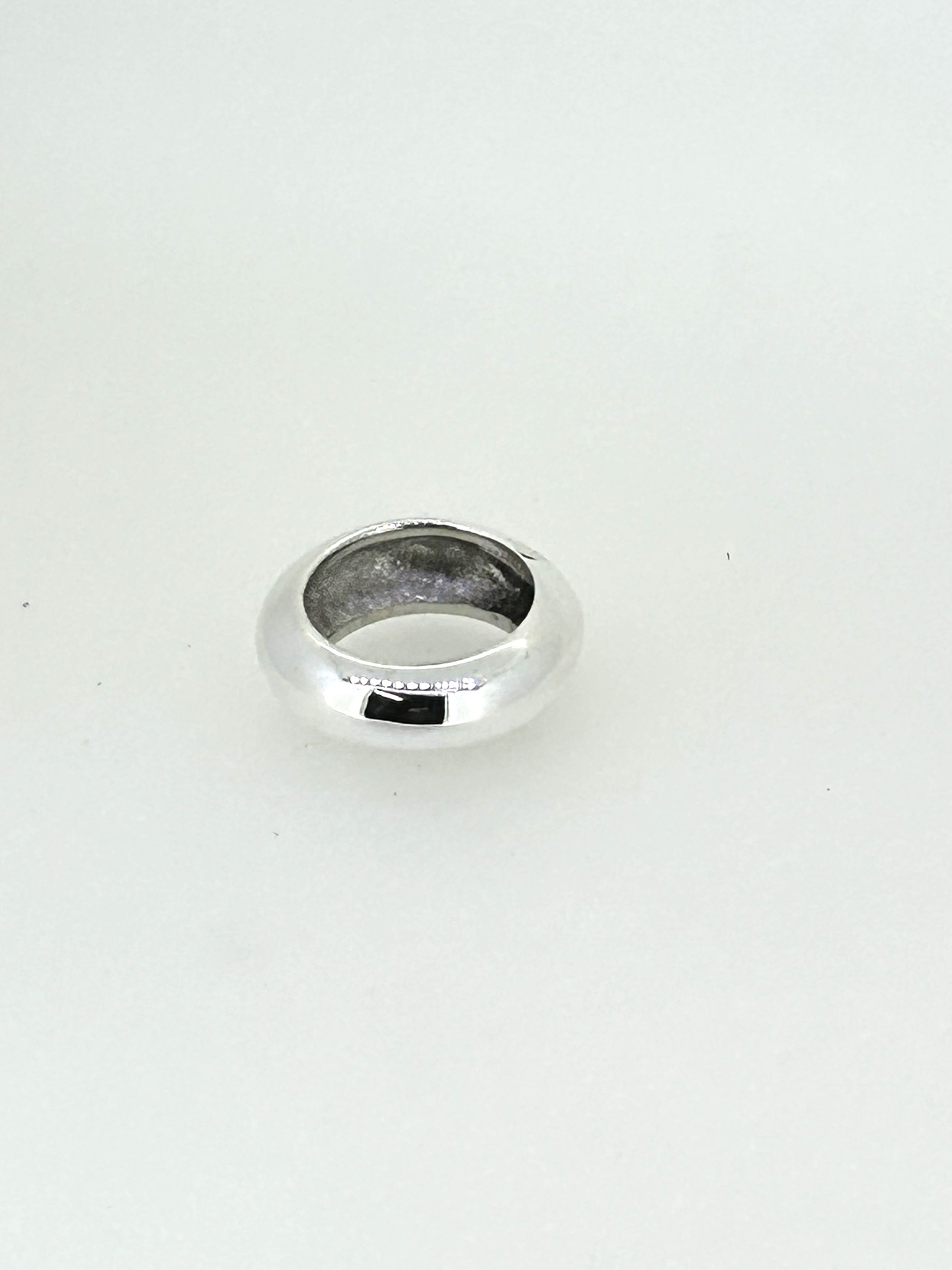 Silver Half-Round Hollow Ring, A polished silver half-round hollow ring.