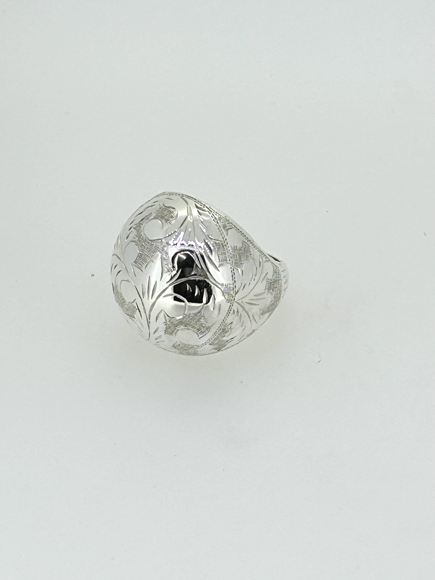 Silver engraved dome ring, A silver ring with an engraved domed design.