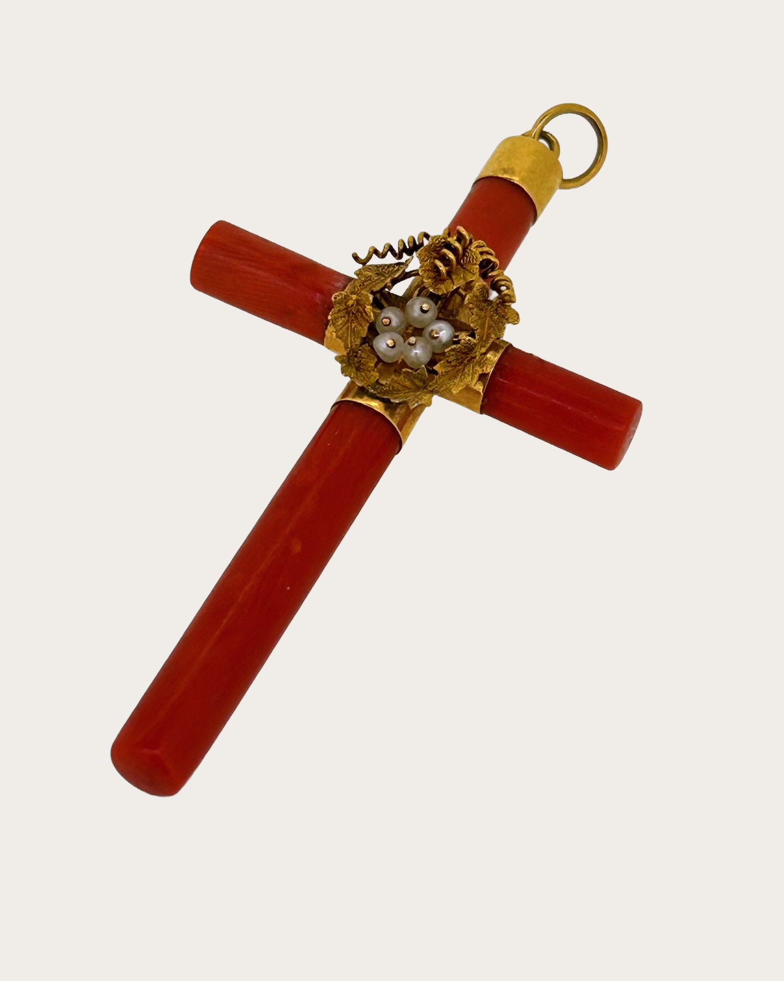 18-carat Yellow Gold Coral Cross Pendant, Cross pendant in yellow gold with coral and a floral centre.